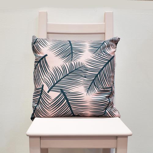 This stunning cotton linen cushion designed and made in England comes in a soft tropical pattern in green on pink for the perfect tropical addition to your home.