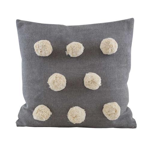 A cosy and inviting cushion with eight cream pom poms on the front in a grey cover. 